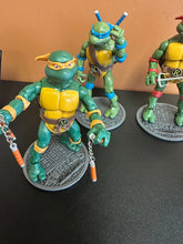 Load image into Gallery viewer, Teenage Mutant Ninja Turtles Classic Set of 4 Figures Preowned
