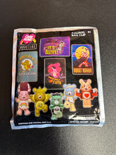 Load image into Gallery viewer, CARE BEARS X UNIVERSAL MONSTERS FIGURAL MYSTERY BAG CLIP SEALED
