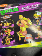 Load image into Gallery viewer, JAKKS PACIFIC TMNT XPV RC SKATEBOARDING MIKEY WORKS PREOWNED
