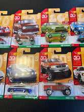 Load image into Gallery viewer, Hot Wheels 2017 50th Anniversary Decades Set of 10
