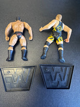 Load image into Gallery viewer, Jakks Pacific WrestleMania XV 2 Tuff 3 The Rock &amp; Owen Hart w/ Stands
