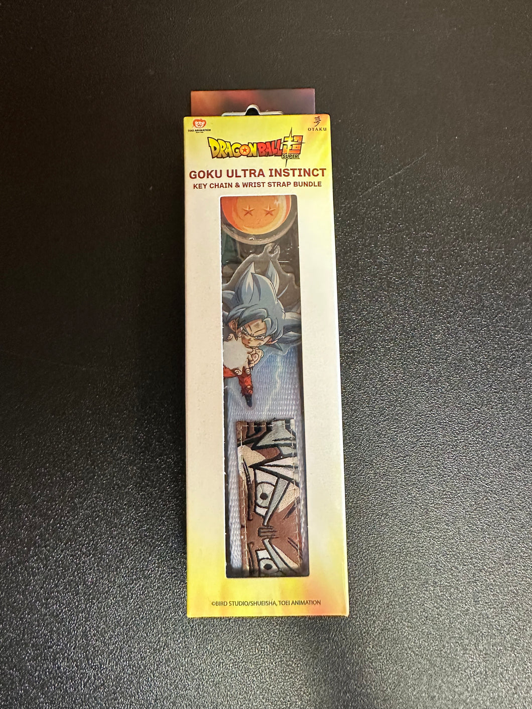 Dragonball Super Goku Ultra Instinct Keychain & Wrist Strap Bundle